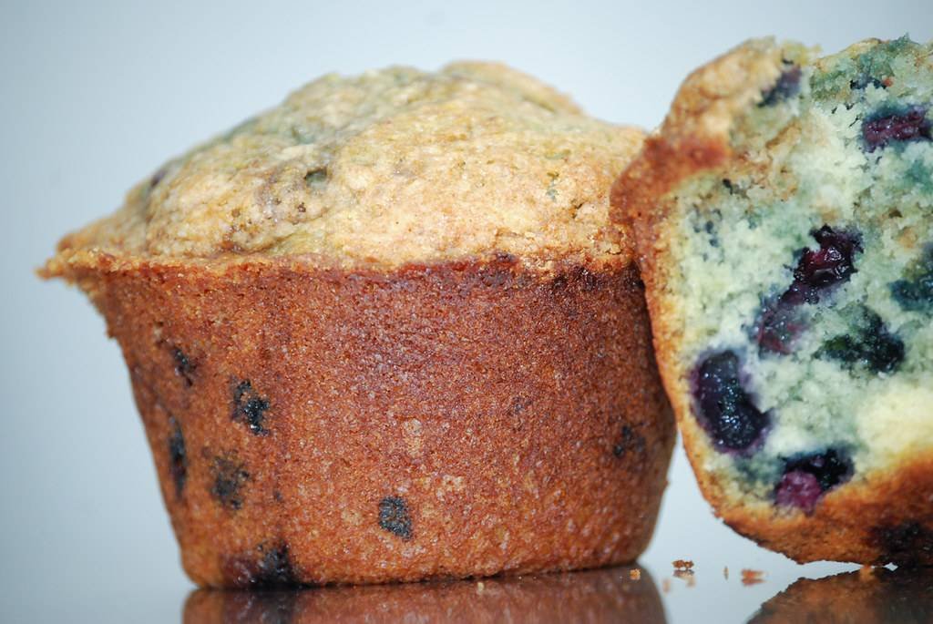 Tray of freshly baked blueberry muffins, an example of a beginner-friendly recipe from a home baking course