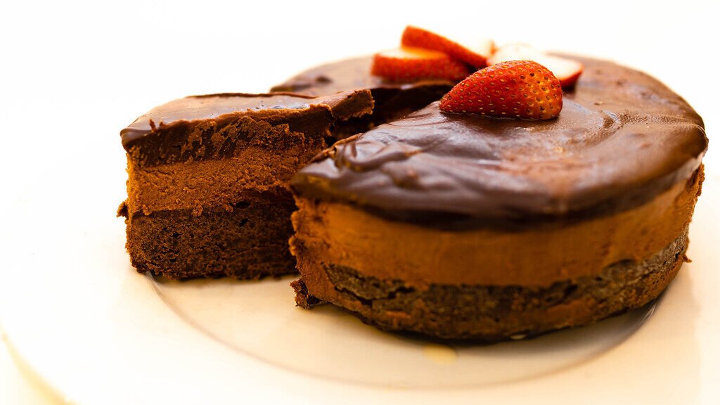 Eggless chocolate mousse cake topped with a strawberry